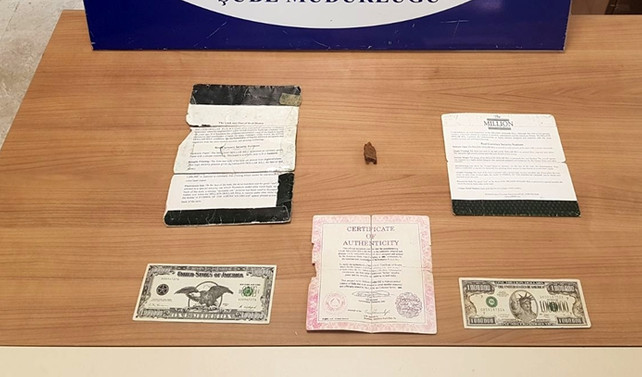 Bir milyon dolarlık banknotları satmaya çalıştılar